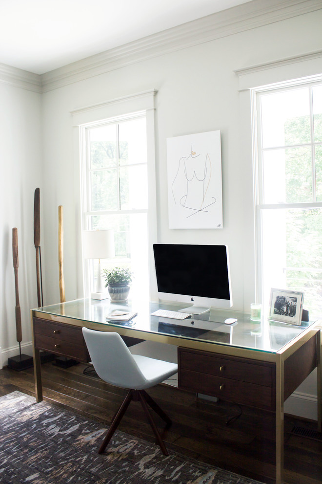 Photo of a mid-sized transitional home office in DC Metro with grey walls, dark hardwood floors, a freestanding desk and brown floor.