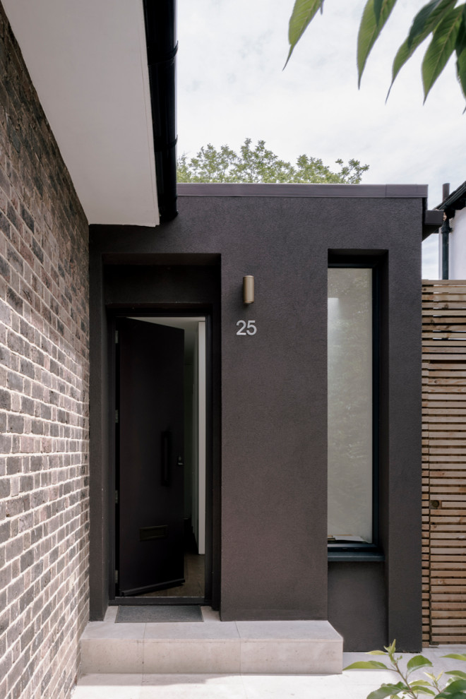 This is an example of a large contemporary two-storey stucco purple house exterior in London with a flat roof, a mixed roof and a black roof.