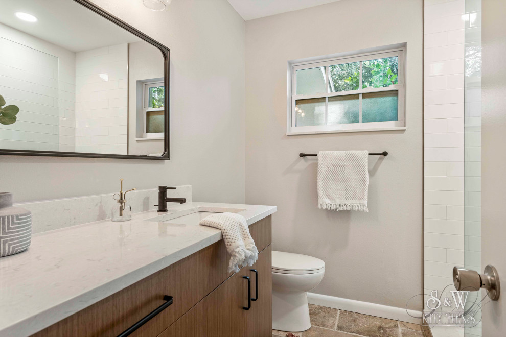 Inspiration for a small modern master bathroom in Tampa with flat-panel cabinets, medium wood cabinets, an open shower, a two-piece toilet, white tile, cement tile, grey walls, travertine floors, an undermount sink, quartzite benchtops, beige floor, an open shower and white benchtops.