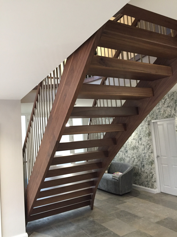 Inspiration for a mid-sized contemporary wood curved staircase in Other.