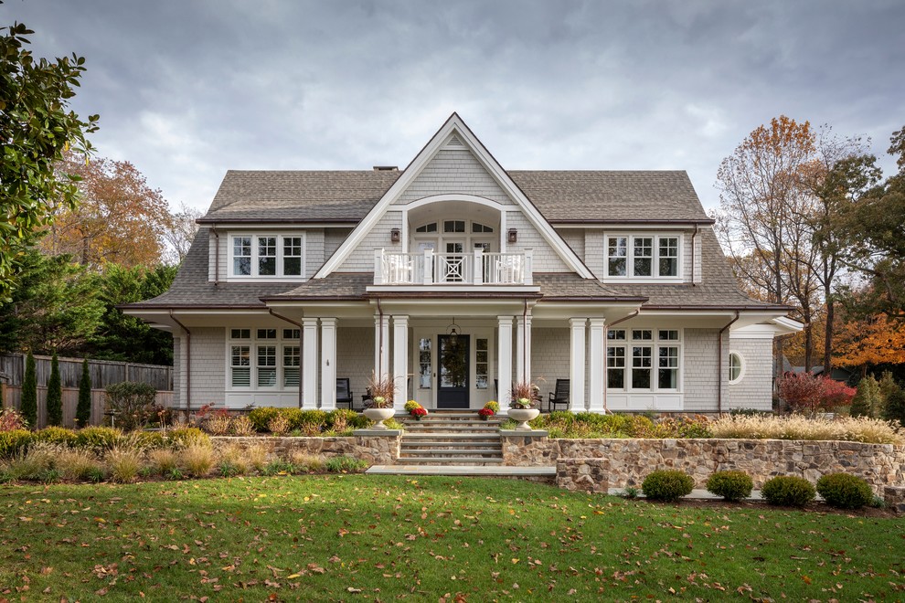 Inspiration for a traditional two-storey grey house exterior in Baltimore with a gable roof and a shingle roof.