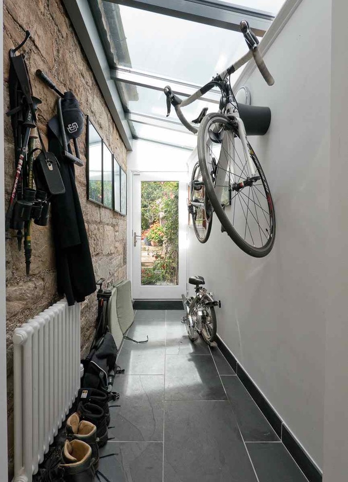 Design ideas for a large classic boot room in Edinburgh with white walls, slate flooring, a single front door, a white front door and grey floors.