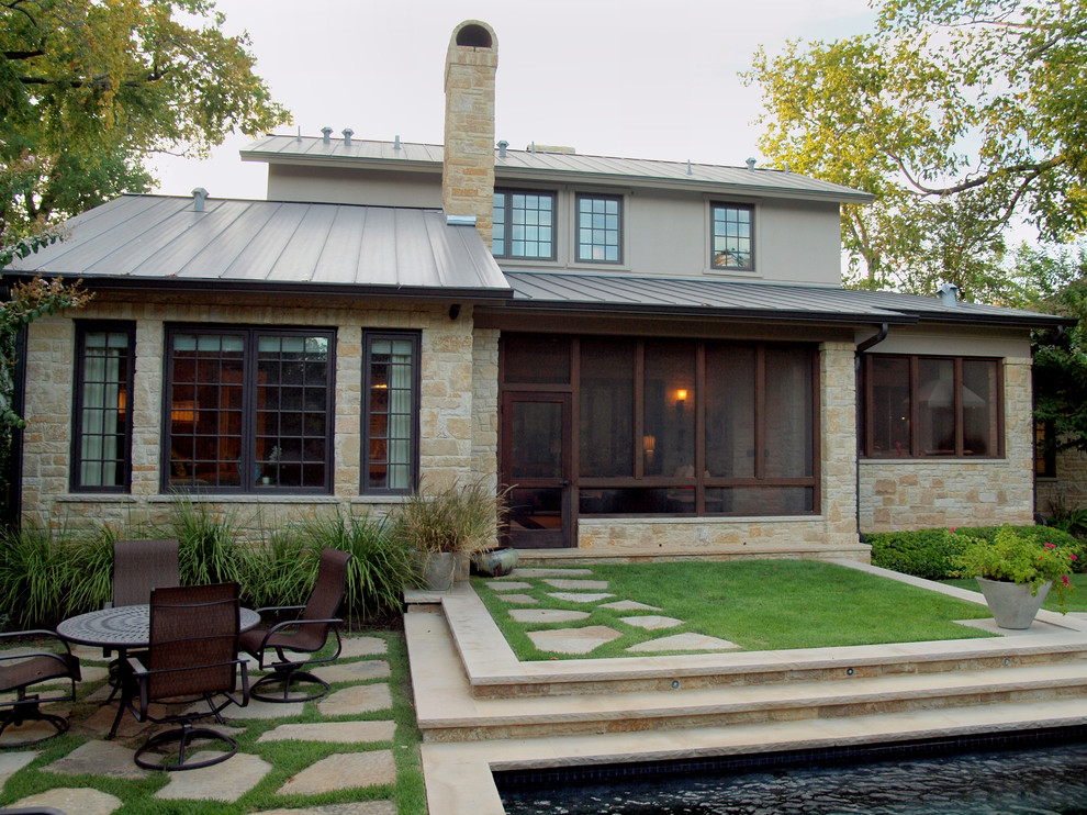 Contemporary backyard garden in Austin with natural stone pavers.