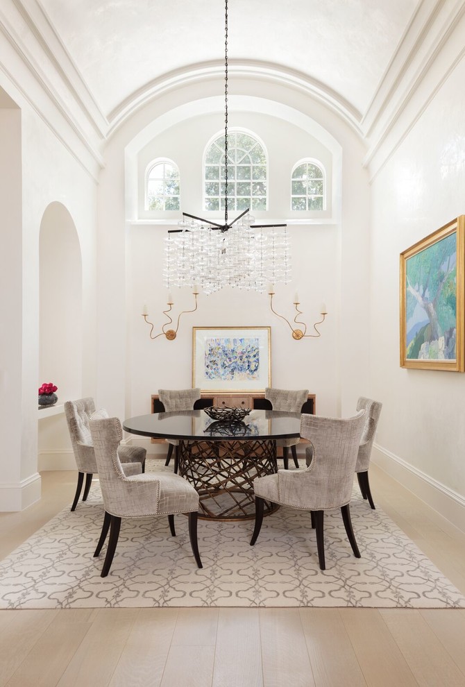 Photo of a large transitional separate dining room in Miami with white walls, light hardwood floors and no fireplace.