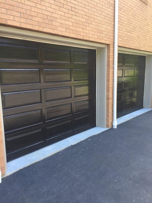 Example of a large attached garage design in New York