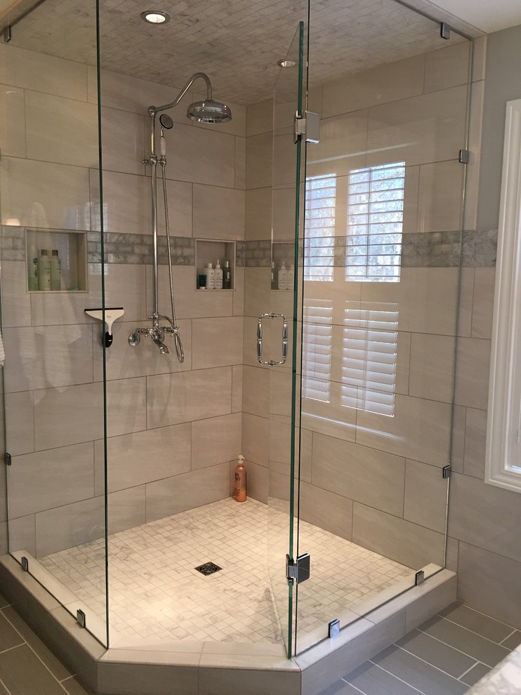 Inspiration for a transitional master gray tile and porcelain tile porcelain tile home design remodel in Grand Rapids with white cabinets, gray walls, an undermount sink and marble countertops