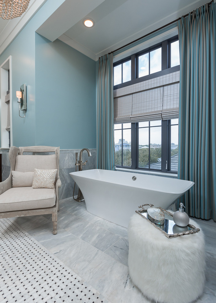 Inspiration for a large transitional master bathroom in Miami with a freestanding tub, gray tile, blue walls, open cabinets, medium wood cabinets, an alcove shower, a one-piece toilet, marble floors, an undermount sink and marble benchtops.