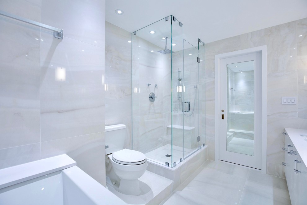 Example of a mid-sized transitional master white floor freestanding bathtub design with flat-panel cabinets, white cabinets, a hinged shower door, white walls and an undermount sink