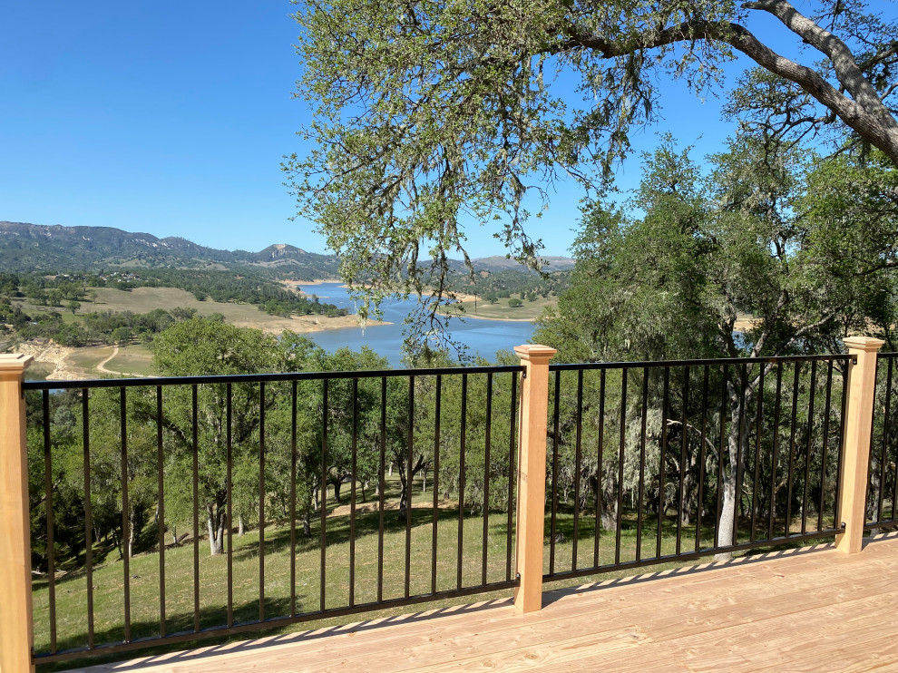 Inspiration for a mid-sized rustic backyard ground level mixed material railing deck remodel in San Luis Obispo with no cover