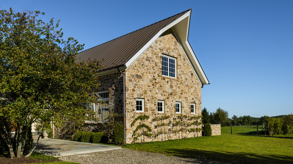 Inspiration for a country exterior in New York with stone veneer.