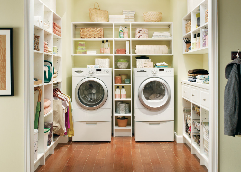 Inspiration for a mid-sized traditional u-shaped laundry room in Boston with open cabinets, white cabinets, solid surface benchtops, dark hardwood floors, a side-by-side washer and dryer and beige walls.