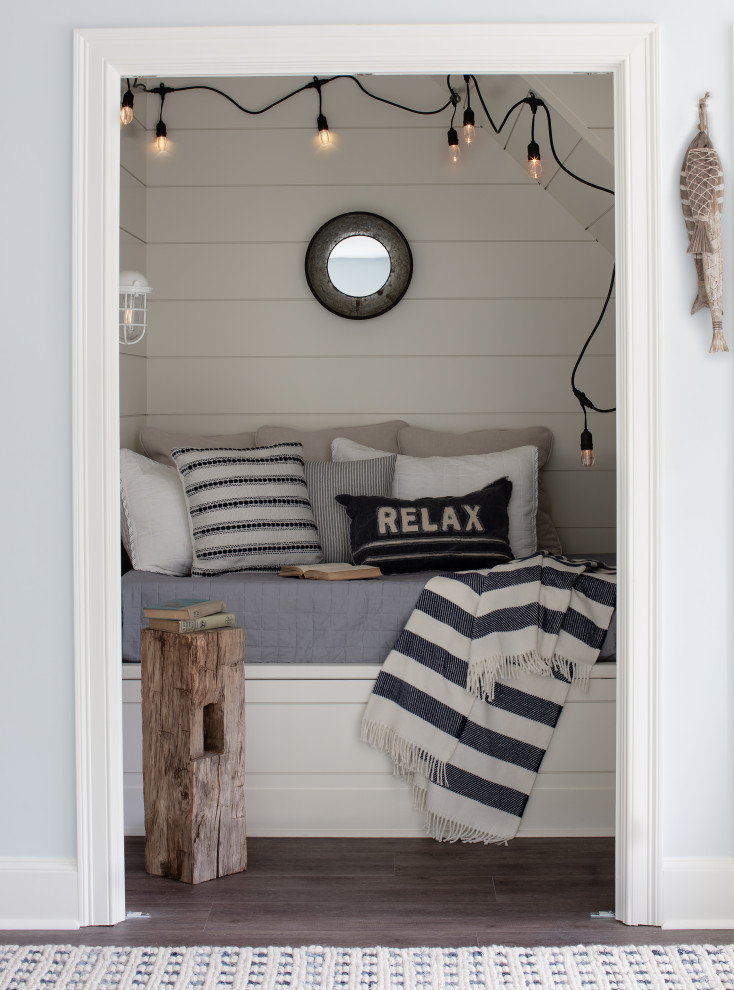 Design ideas for a beach style bedroom in Providence with planked wall panelling.