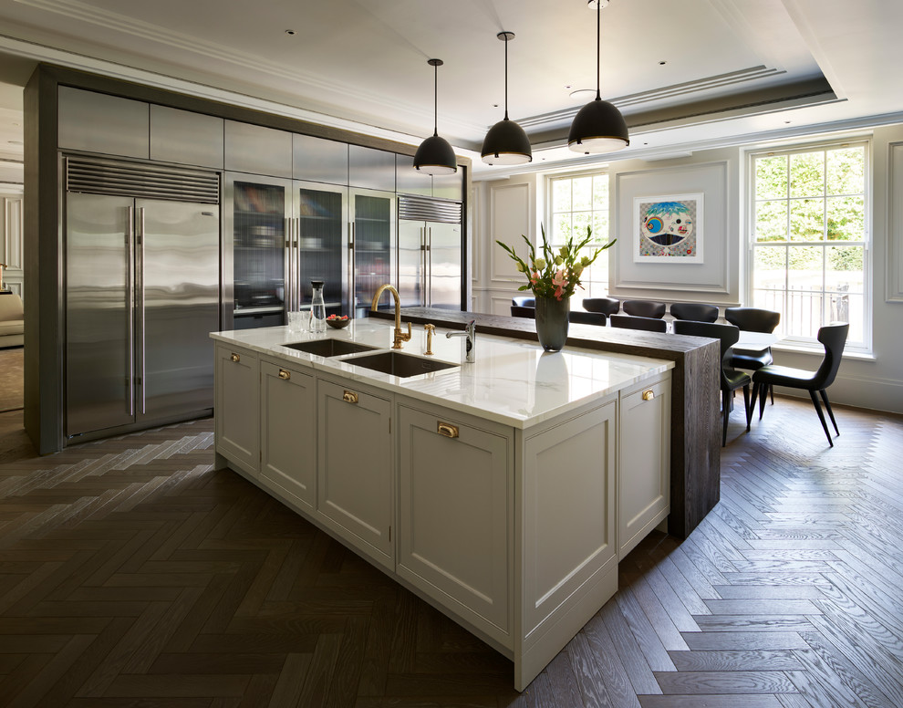 Inspiration for a large contemporary l-shaped eat-in kitchen in London with with island.