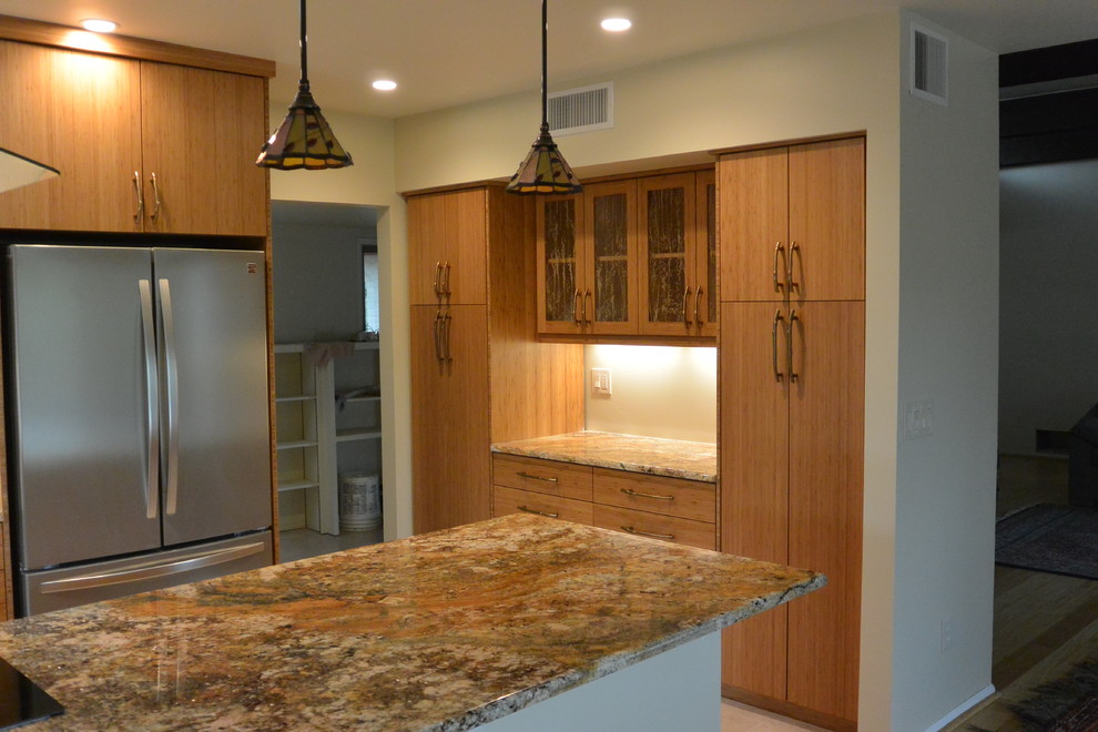 Eat-in kitchen - transitional u-shaped porcelain tile and beige floor eat-in kitchen idea with an undermount sink, flat-panel cabinets, light wood cabinets, granite countertops, stainless steel appliances, a peninsula and brown countertops