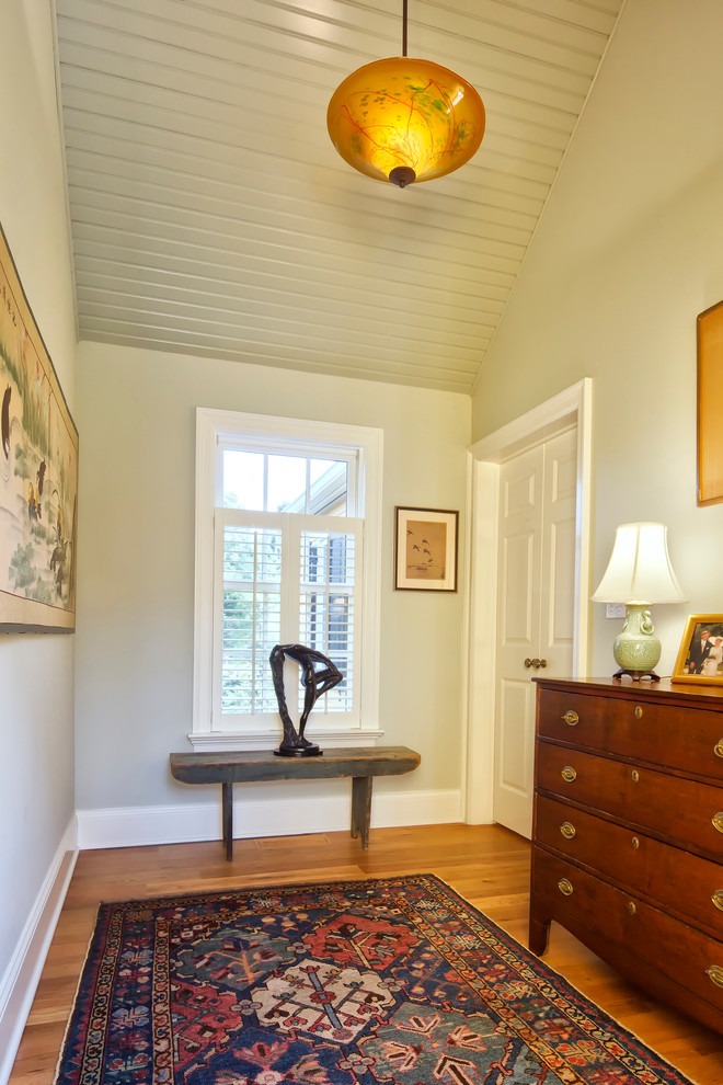 Design ideas for a traditional hallway in New York with grey walls and medium hardwood floors.
