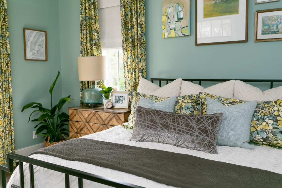 Small traditional bedroom in Charleston with green walls, dark hardwood floors and brown floor.