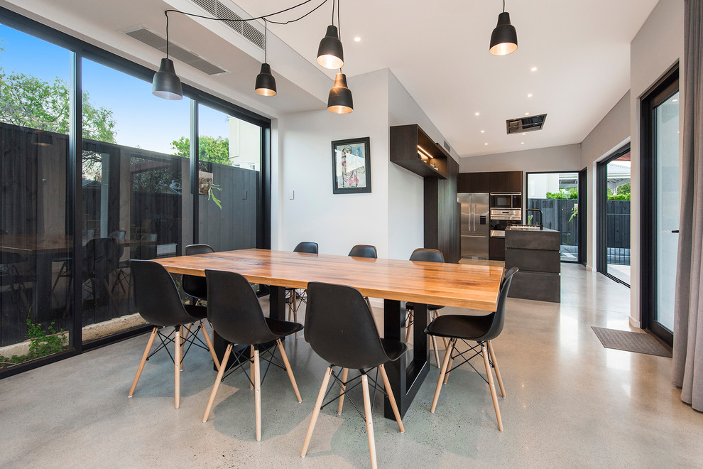 Inspiration for a contemporary separate dining room in Perth with grey walls, concrete floors and grey floor.