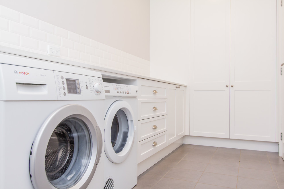 Transitional laundry room in Sydney.