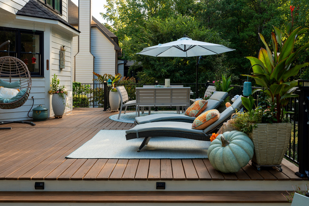 Transitional backyard second story metal railing deck photo in Atlanta with a bbq area and no cover