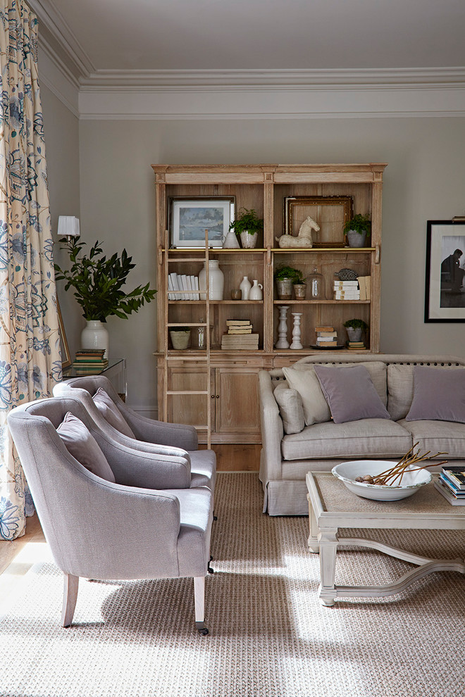 This is an example of a mid-sized transitional living room in Gloucestershire with medium hardwood floors.