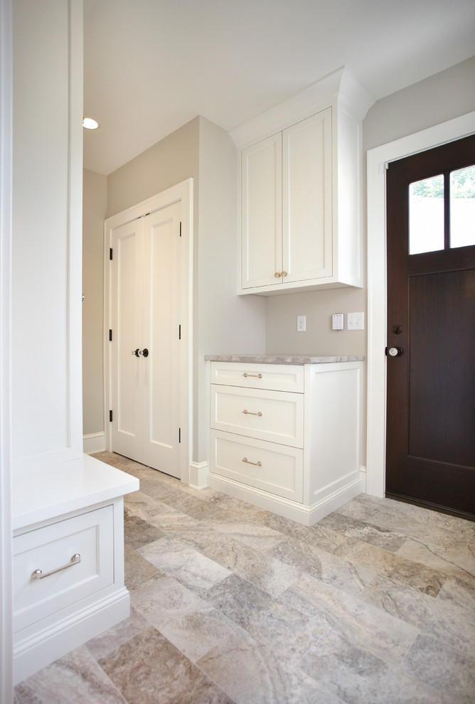 Photo of a mid-sized transitional mudroom in Minneapolis with grey walls, medium hardwood floors, a single front door and a dark wood front door.