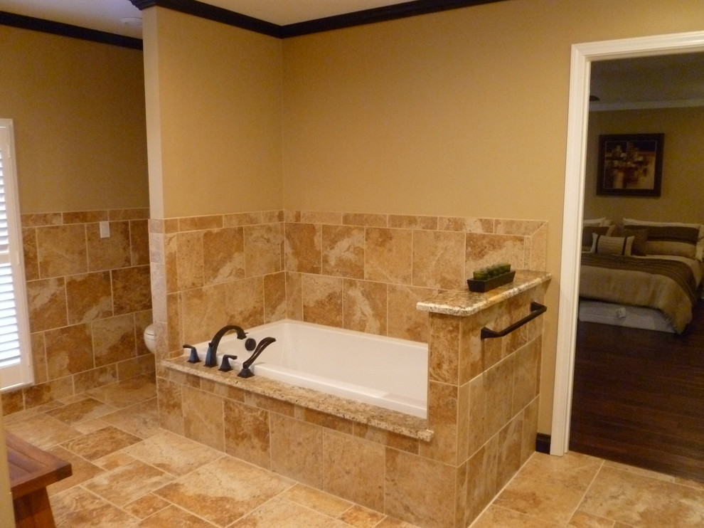 Large contemporary bathroom in Nashville with an undermount sink, raised-panel cabinets, dark wood cabinets, granite benchtops, a drop-in tub, a one-piece toilet, beige tile, stone tile, beige walls, travertine floors and with a sauna.