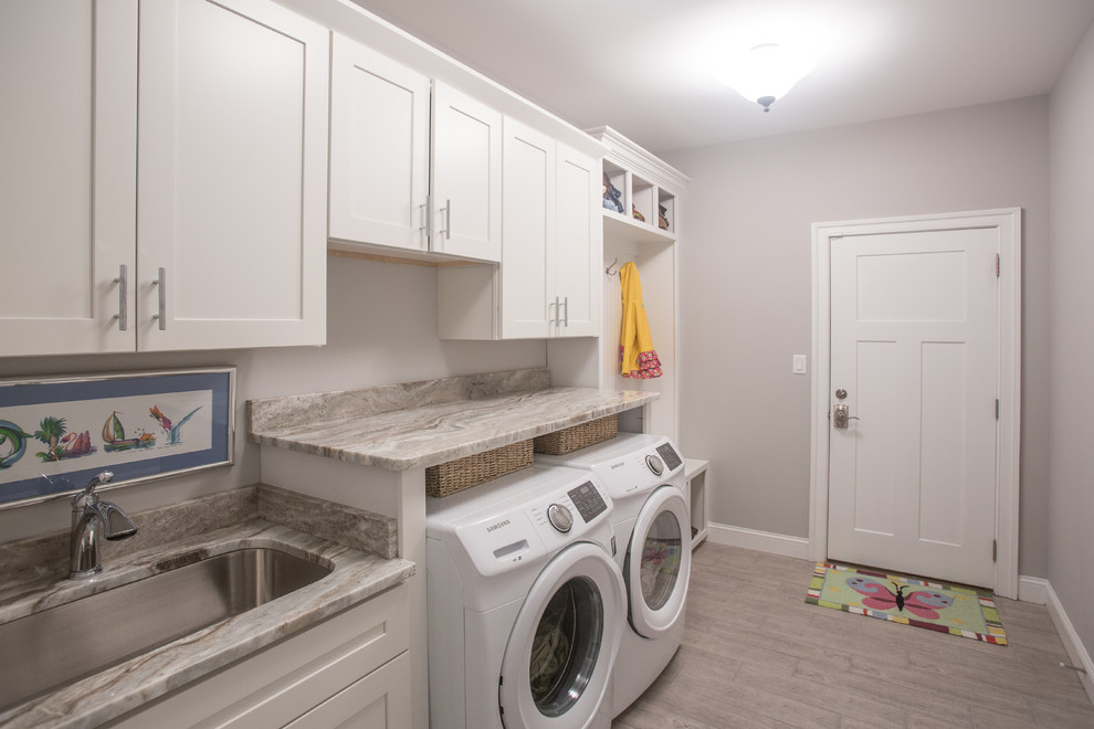 Large arts and crafts single-wall utility room in Other with an undermount sink, shaker cabinets, white cabinets, marble benchtops, grey walls, ceramic floors, a side-by-side washer and dryer, beige floor and grey benchtop.
