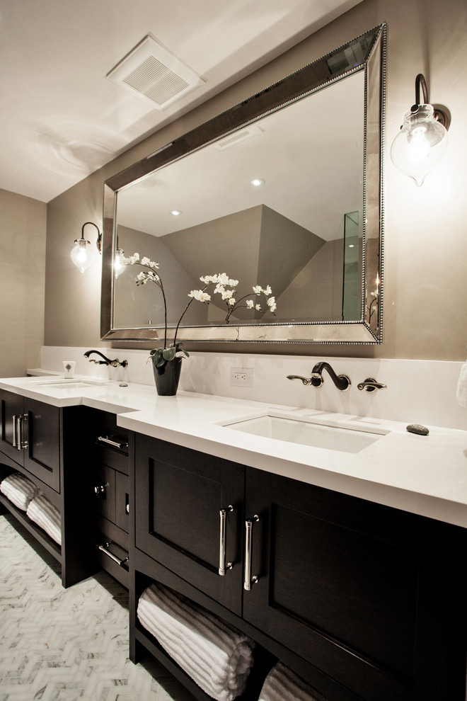 Design ideas for a mid-sized transitional master bathroom in Toronto with an undermount sink, shaker cabinets, dark wood cabinets, engineered quartz benchtops, a freestanding tub, a corner shower, a one-piece toilet, white tile, beige walls and marble floors.