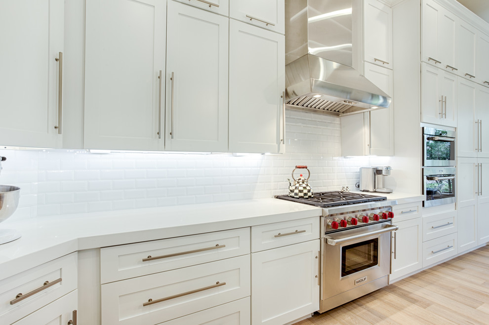 Large transitional galley open concept kitchen photo in Phoenix with shaker cabinets and an island