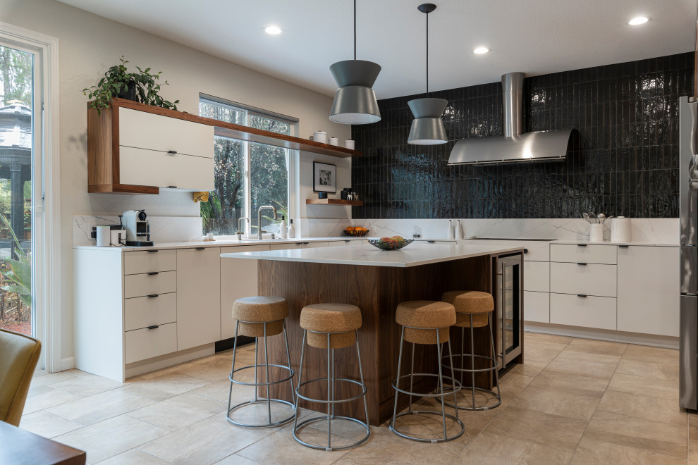 Design ideas for a mid-sized contemporary u-shaped open plan kitchen in Sacramento with a drop-in sink, flat-panel cabinets, dark wood cabinets, quartz benchtops, black splashback, porcelain splashback, stainless steel appliances, with island and white benchtop.