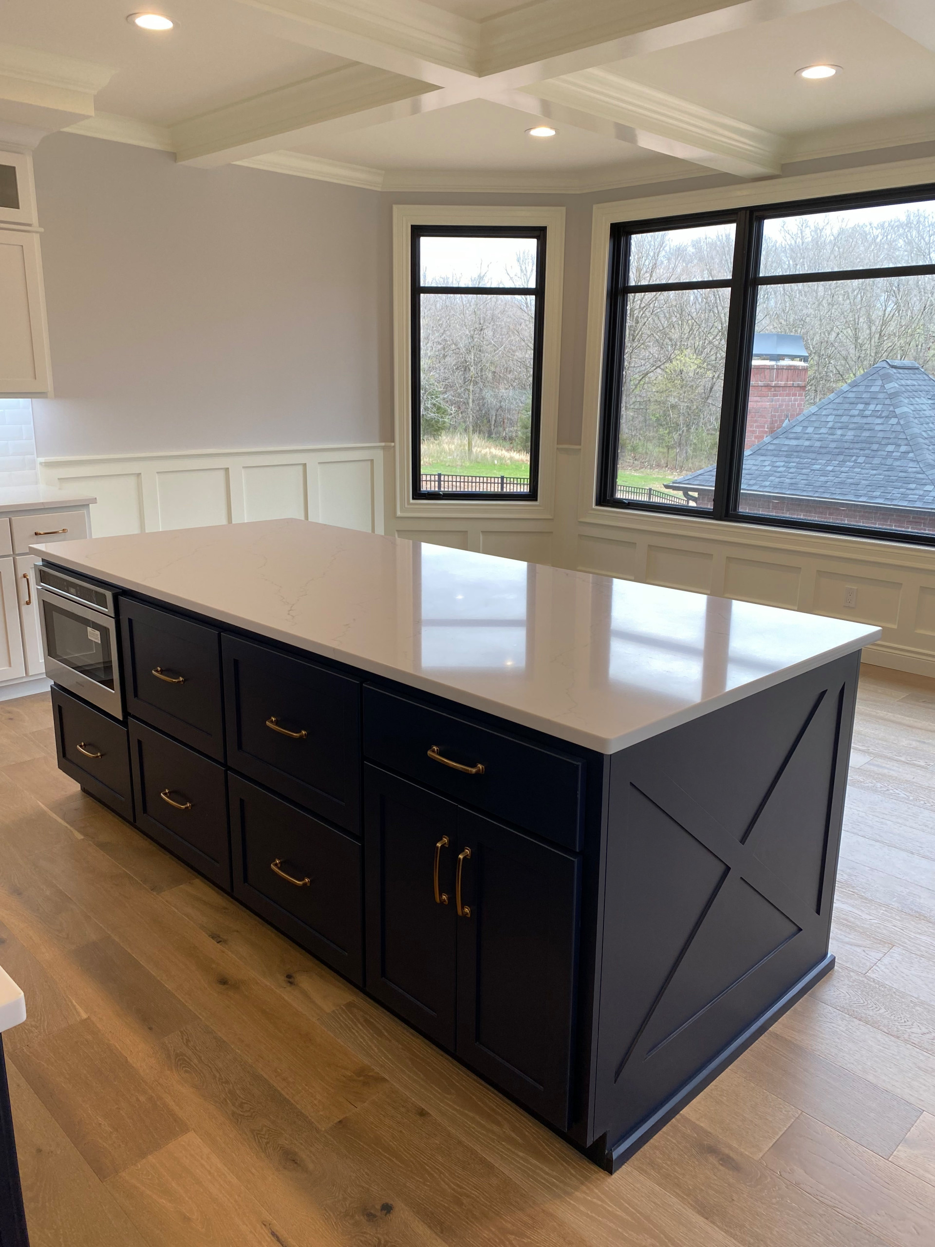 Custom painted island with quartz countertop