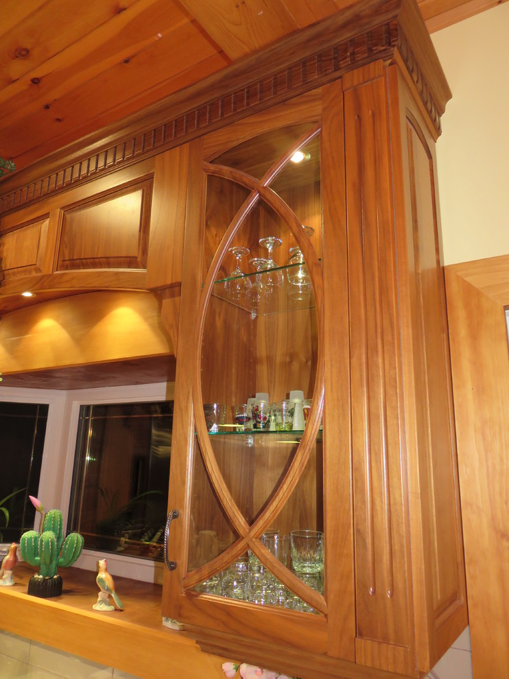 Example of a large transitional l-shaped ceramic tile open concept kitchen design with raised-panel cabinets, medium tone wood cabinets, granite countertops, an island, a double-bowl sink, white backsplash, subway tile backsplash and stainless steel appliances