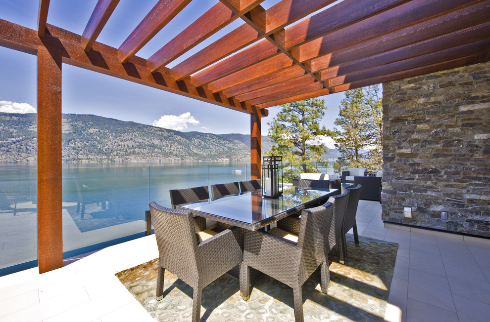 Design ideas for a contemporary balcony in Vancouver with a pergola.