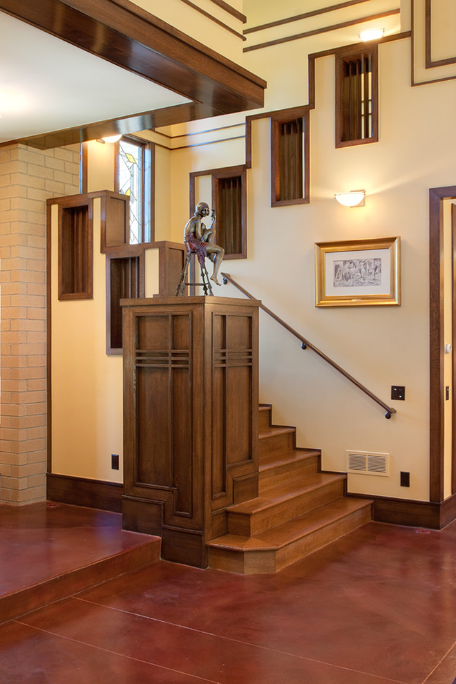 Photo of an arts and crafts wood staircase in Denver with wood risers.