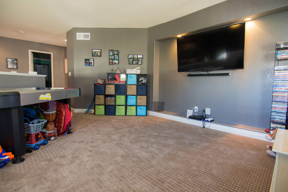 Inspiration for a mid-sized traditional gender-neutral kids' playroom in Los Angeles with grey walls and carpet.