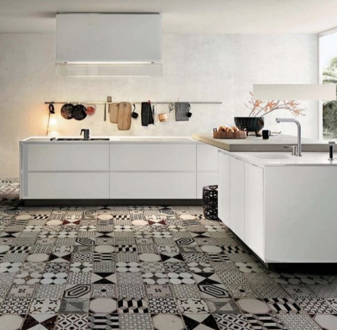 Ispirazione per una cucina minimal con pavimento in cemento