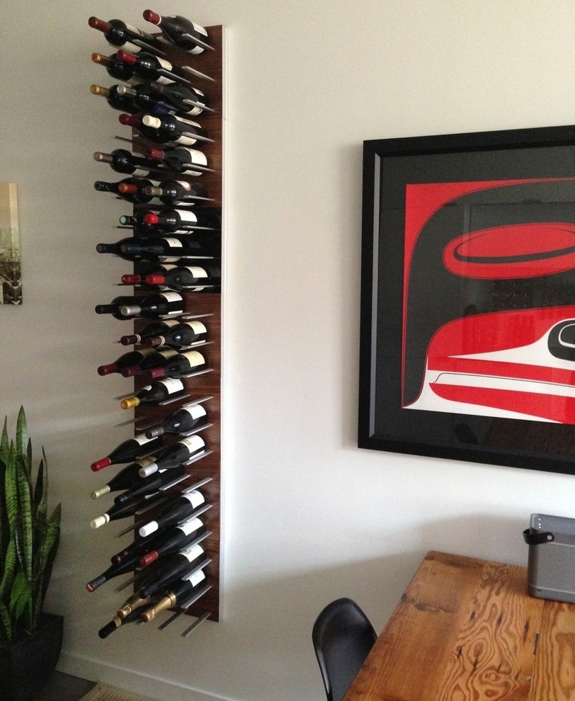 This is an example of a large midcentury wine cellar in Vancouver.
