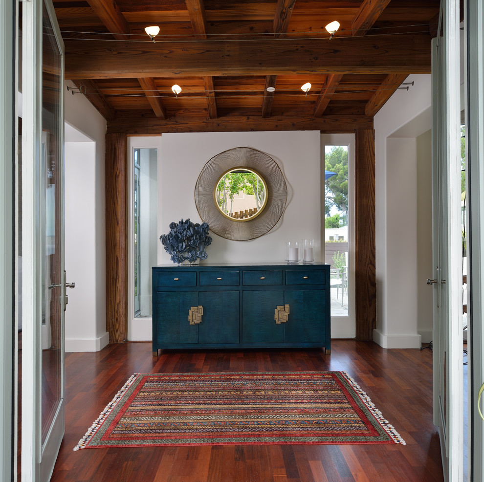 Photo of a mid-sized transitional foyer in San Diego with grey walls, medium hardwood floors, a double front door, a white front door and brown floor.