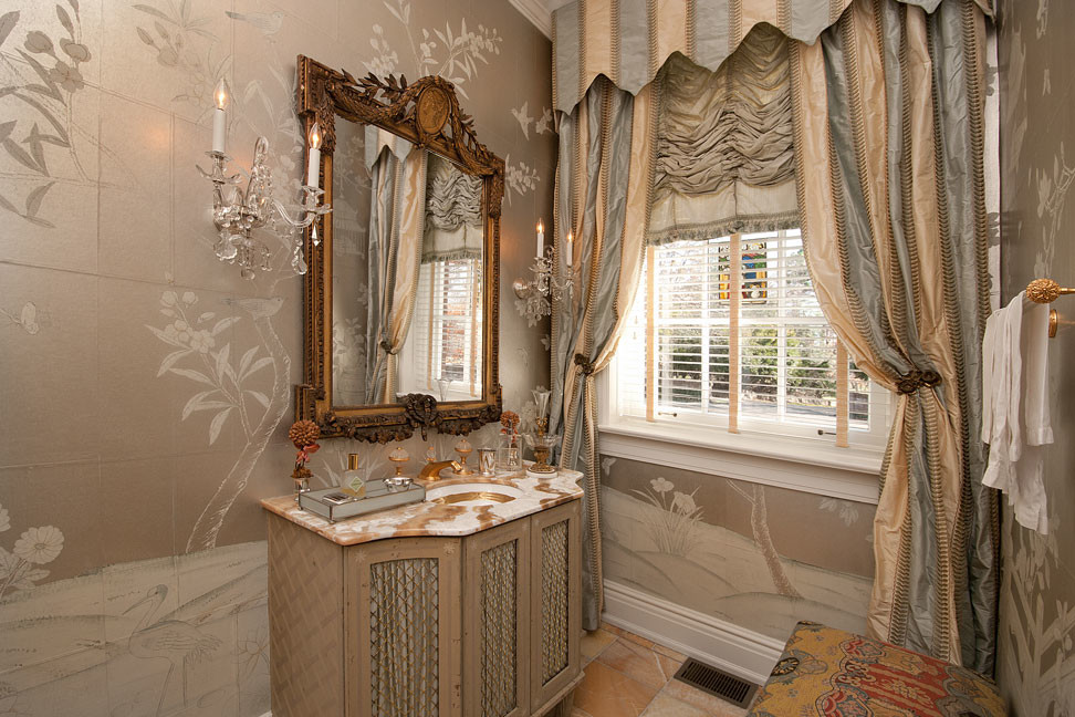 Small traditional powder room in Louisville with grey walls and marble floors.