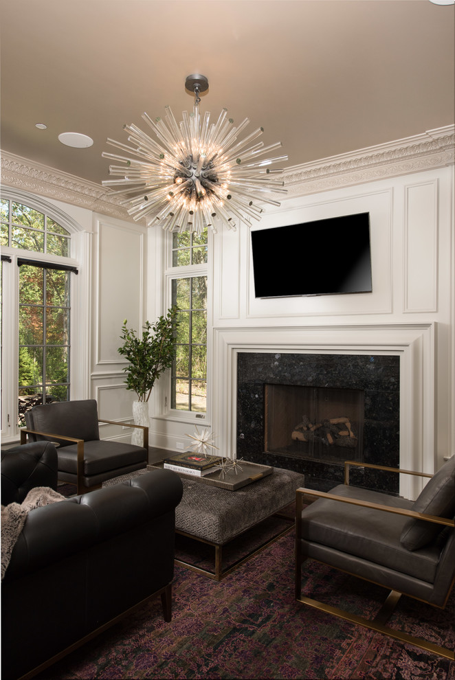 Mid-sized transitional family room in Chicago with a library, beige walls, dark hardwood floors, a standard fireplace, a stone fireplace surround and brown floor.