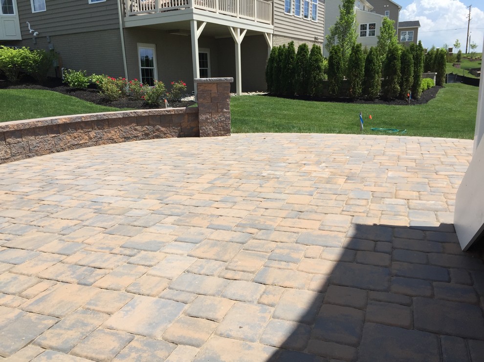 Inspiration for a mid-sized country backyard patio in Baltimore with concrete pavers.