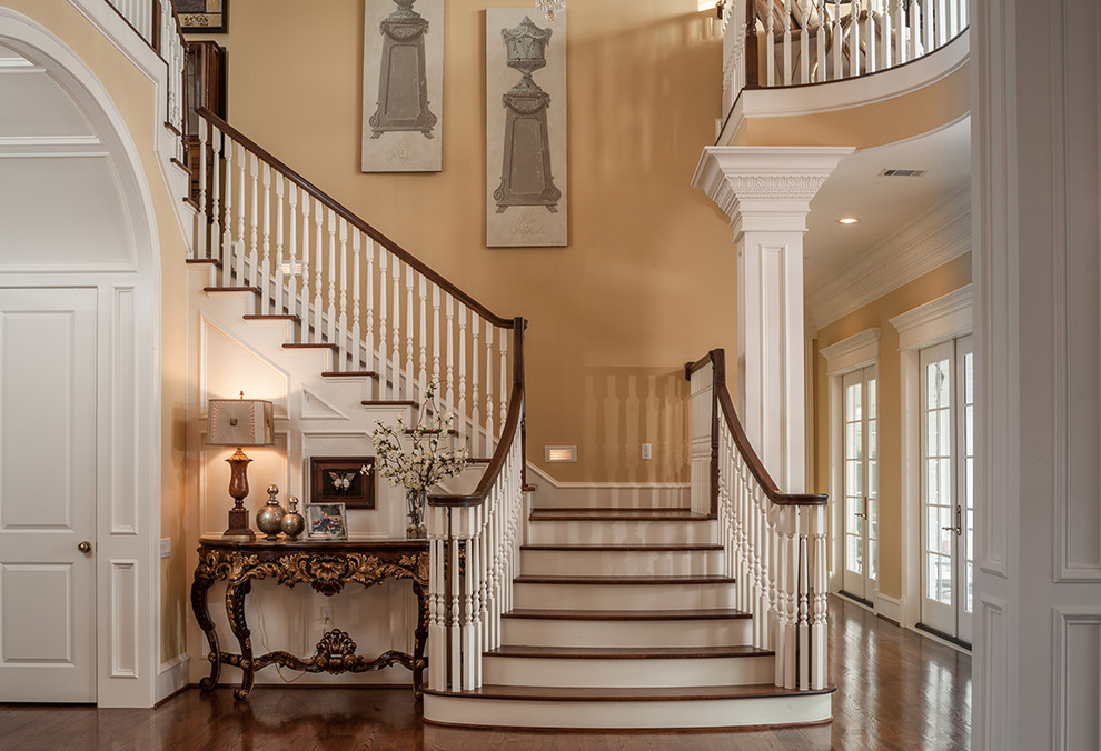 Inspiration for a traditional wood l-shaped staircase in Houston with painted wood risers.