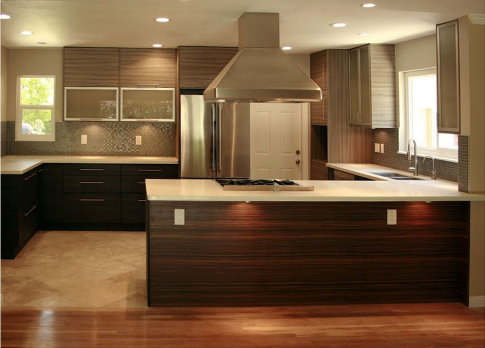 Photo of a contemporary l-shaped eat-in kitchen in San Francisco with an undermount sink, flat-panel cabinets, black cabinets and quartz benchtops.