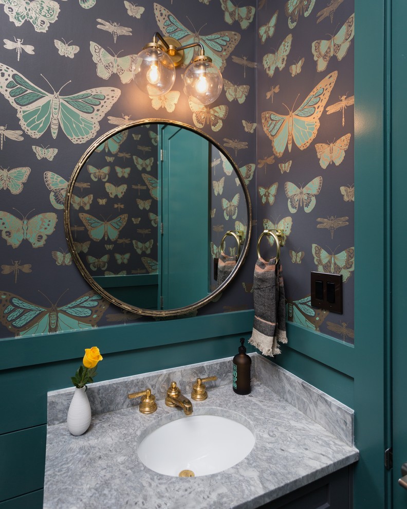 Inspiration for a transitional powder room in Austin with multi-coloured walls, an undermount sink and marble benchtops.