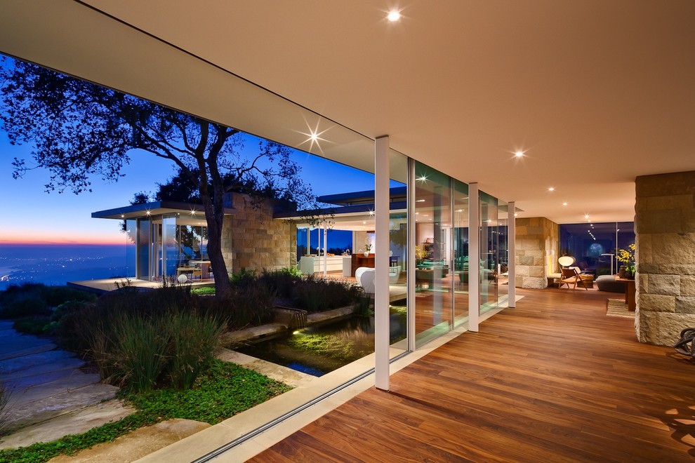 Inspiration for a modern hallway in Santa Barbara with medium hardwood floors and brown floor.