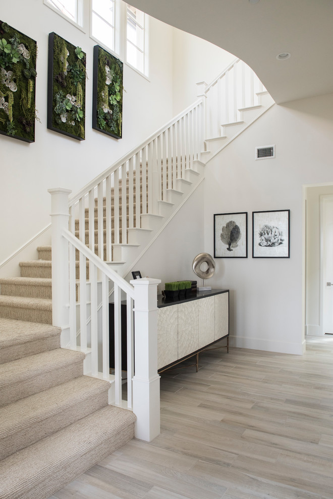 Inspiration for a mid-sized contemporary staircase in Orange County with wood railing.