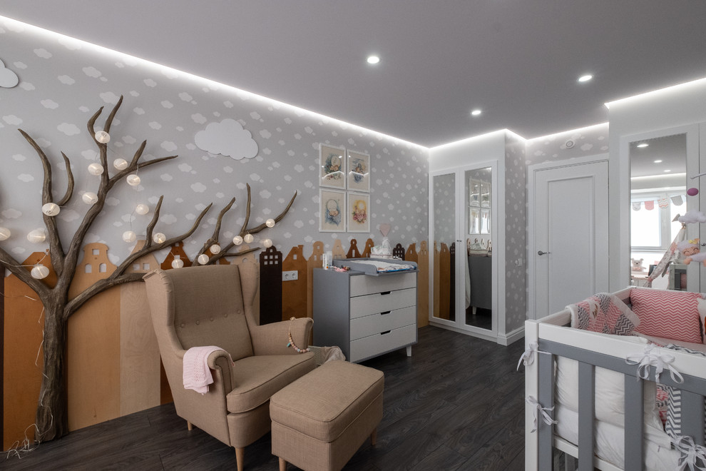 Mid-sized contemporary gender-neutral nursery in Moscow with grey walls, laminate floors and grey floor.
