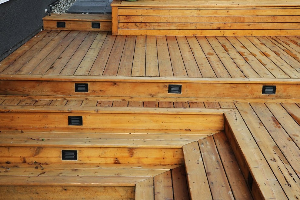 Water fountain deck - large rustic backyard water fountain deck idea in Vancouver with no cover
