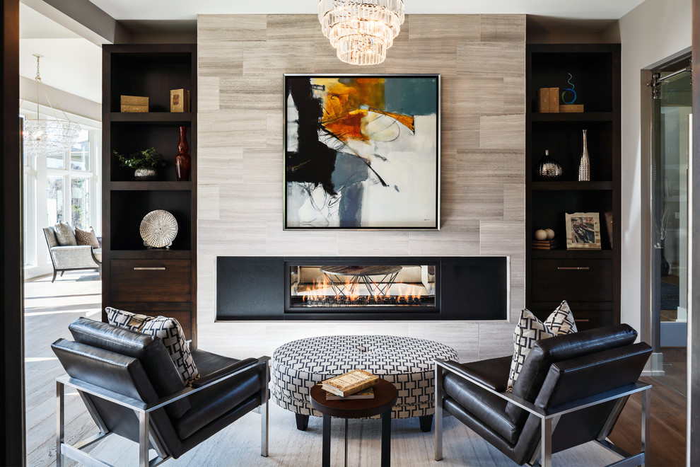 This is an example of a contemporary living room in Grand Rapids with grey walls, dark hardwood floors, a ribbon fireplace and brown floor.