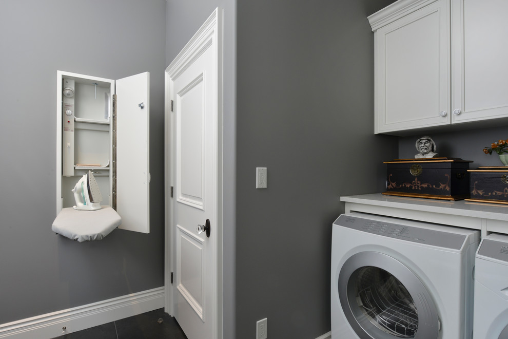 Design ideas for a transitional laundry room in Toronto.